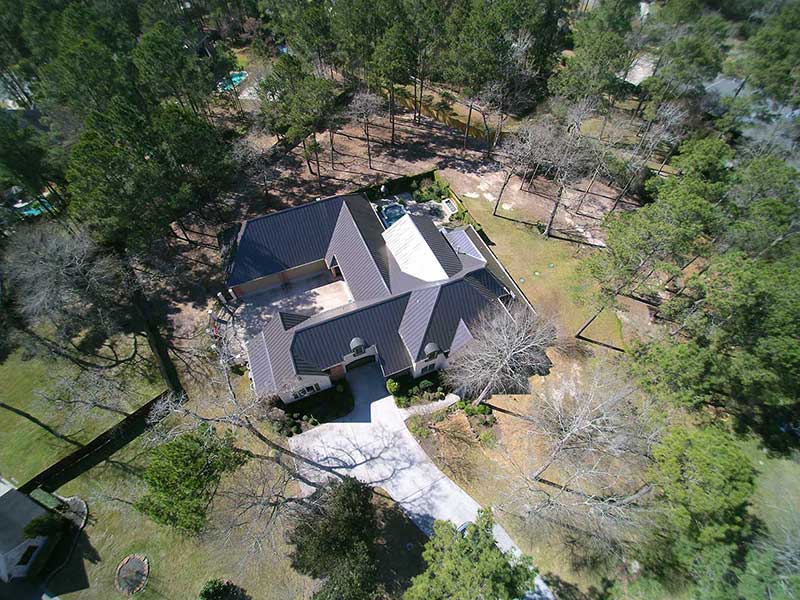 Large house with a metal roof.