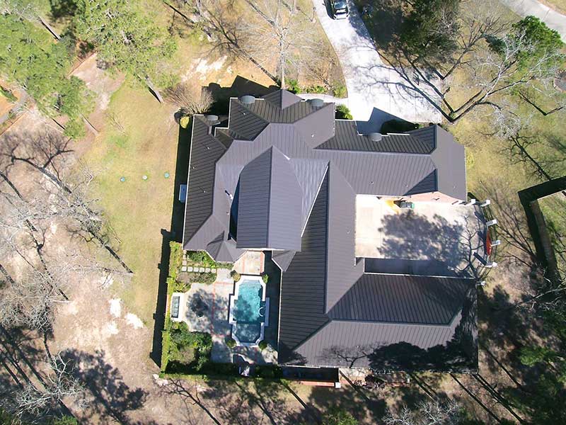 Old composition shingles were removed and replaced with a metal roof.