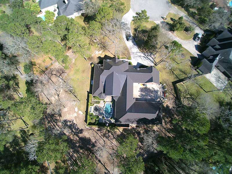 Old composition shingles were removed and replaced with a metal roof.