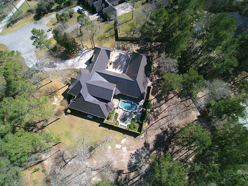 Large house with a metal roof.