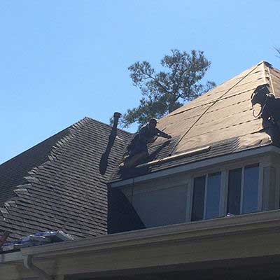 The job of roofers can be dangerous and they require safety equipment.