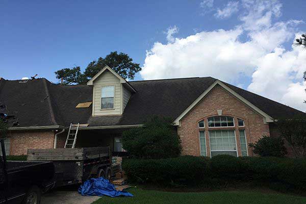 The process of roof replacement begins with a tear off of the old roof shingles.