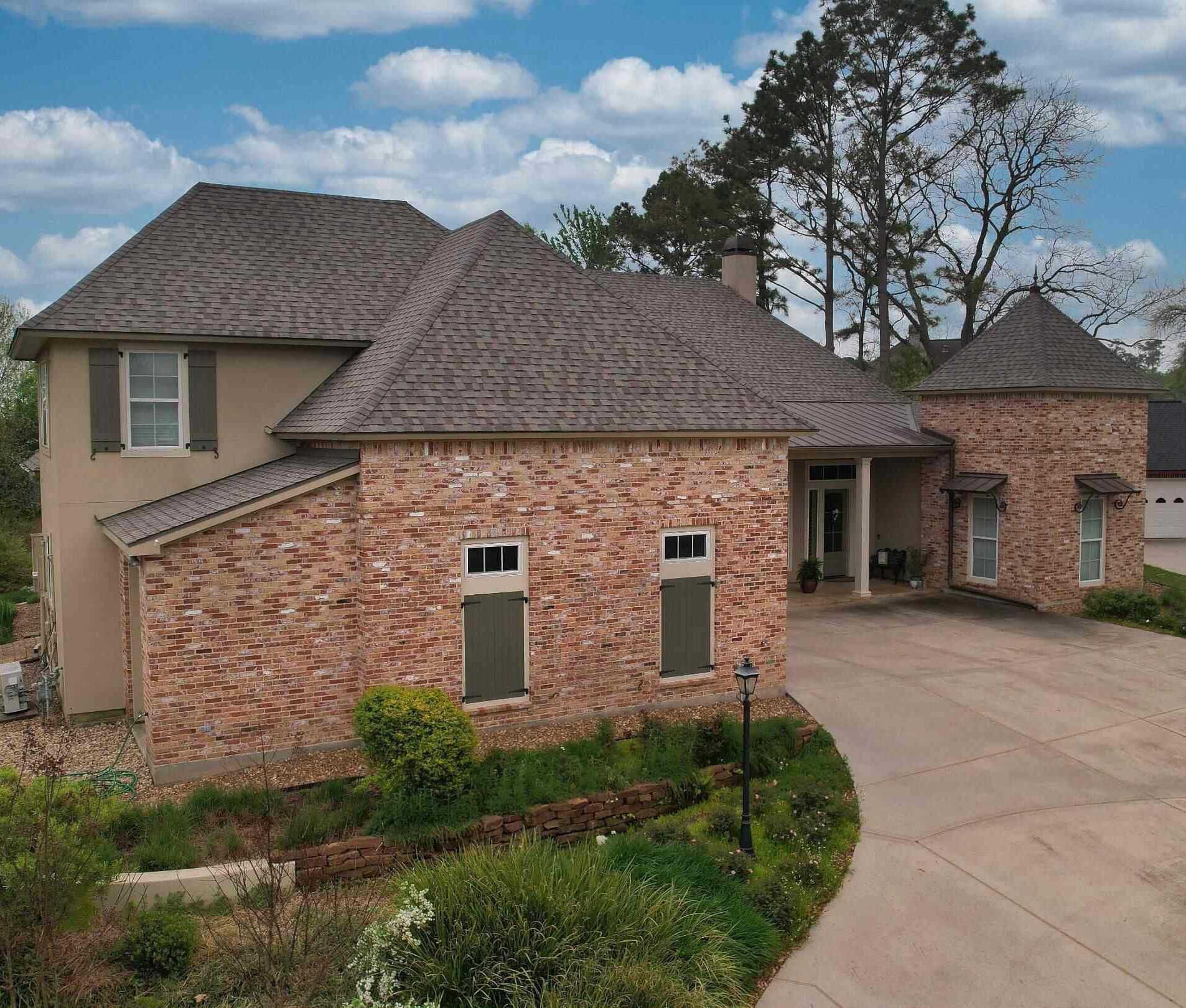 A house with a repaired roof after hail damage.