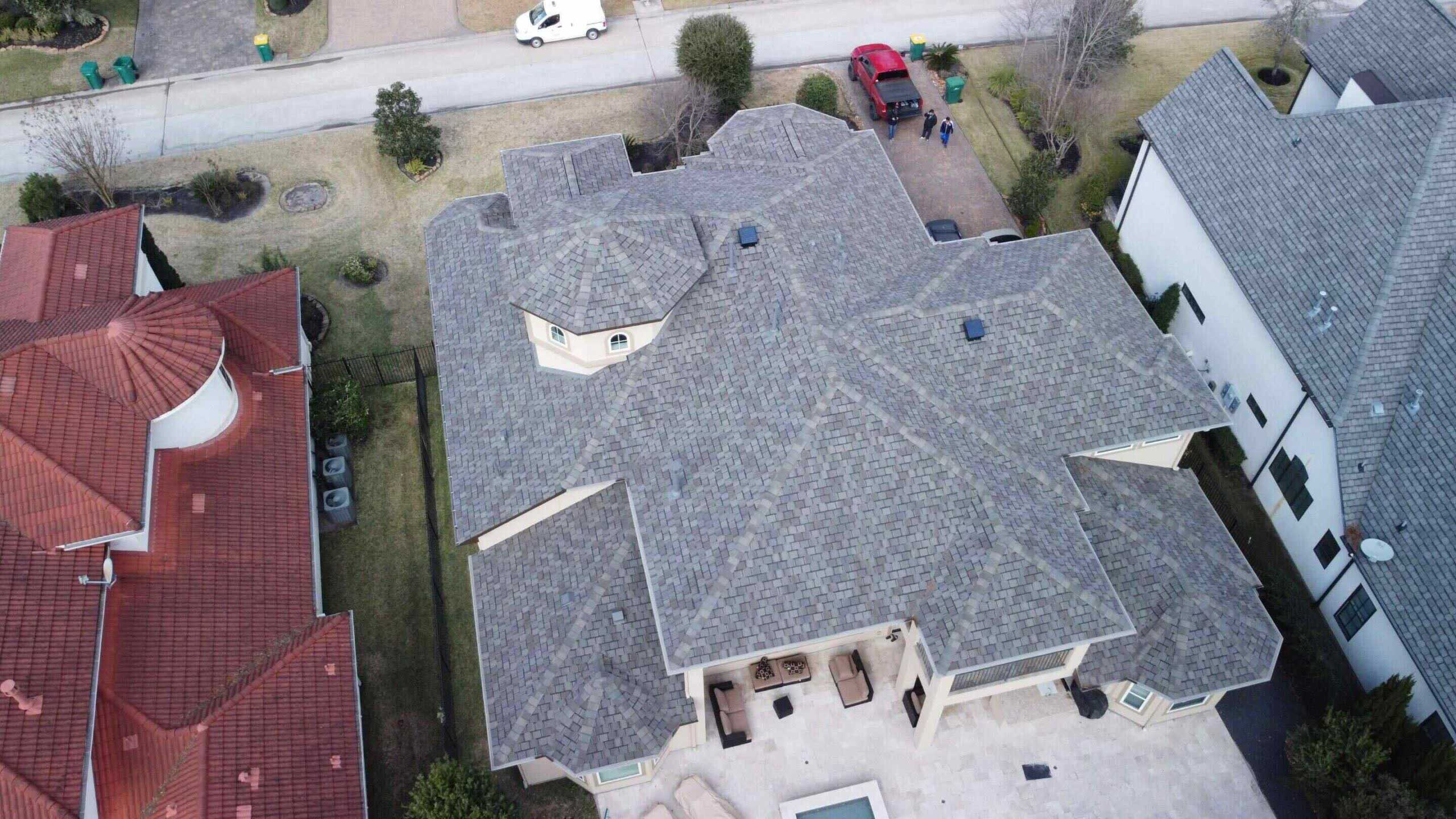 A wind storm had severely damaged the roof on this home.